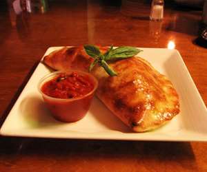 Calzone with pepperoni and mozzarella. 